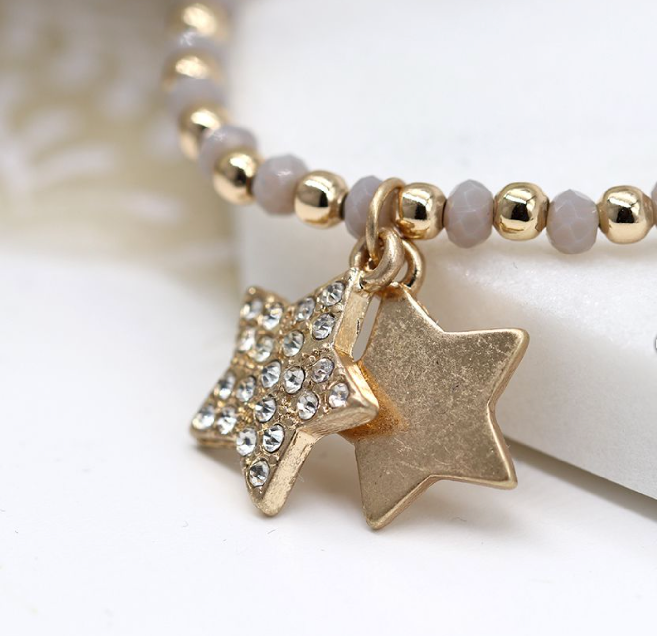 Gold/Grey  braclet with  charms