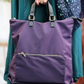 Purple nylon backpack with zip front pocket