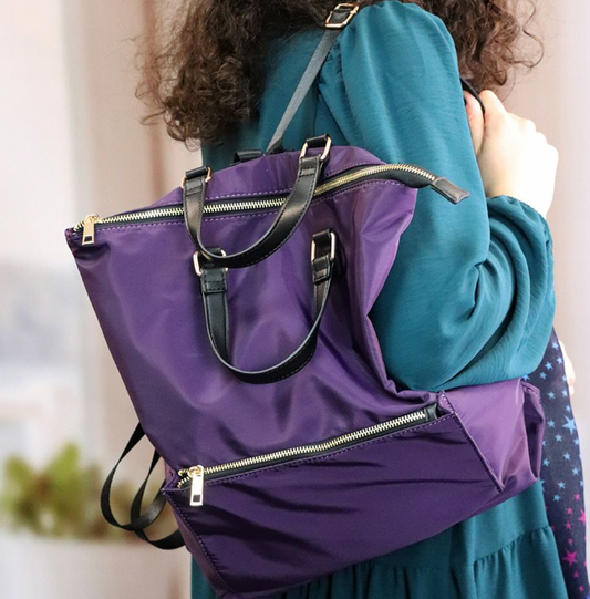 Purple nylon backpack with zip front pocket